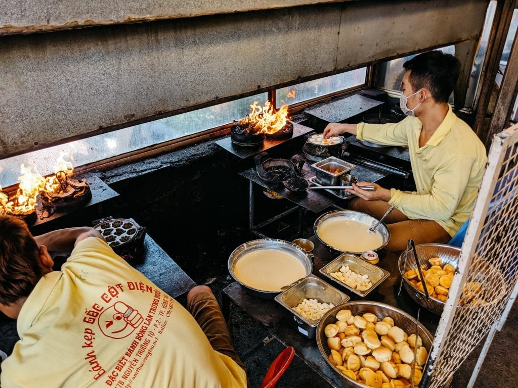 vietnamese food man sitting beside table