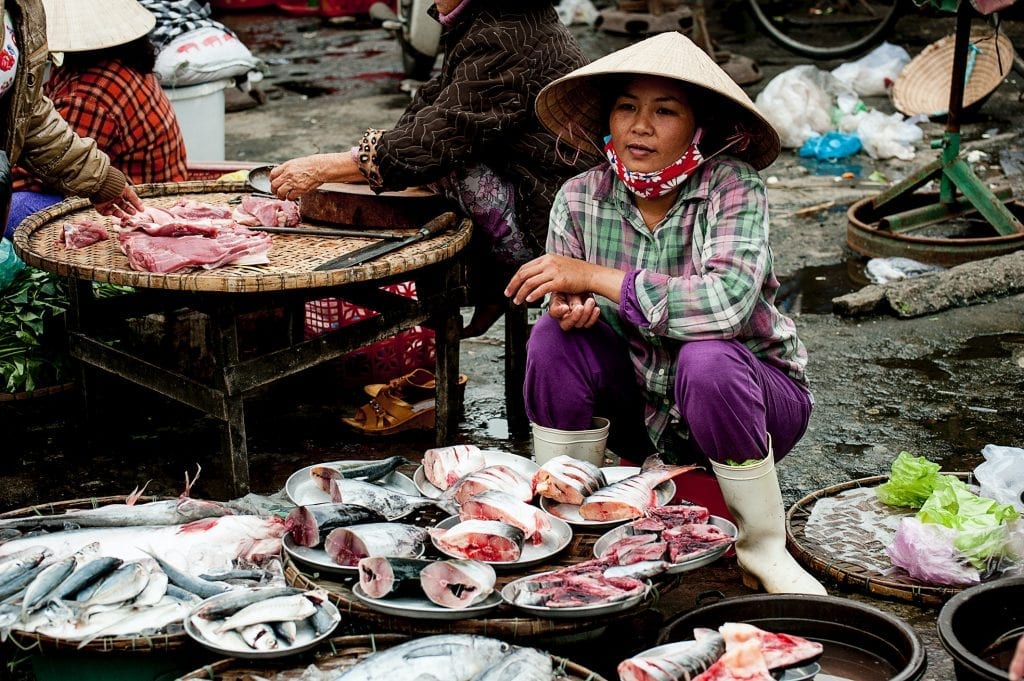 vietnamese food woman sitting on red chair