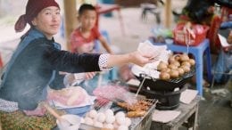 woman handing money to person